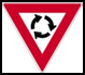 Yield at traffic circle. You must look out for other vehicles and yield to vehicles already in the circle or crossing their yield line first.