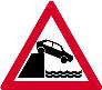 Surface step. The two sides of the carriageway are at different heights ahead, so slow down and avoid sudden steering movements.