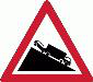 Gravel road begins. The tarred road ends ahead and changes to gravel, so slow down and expect less grip and a longer stopping distance.