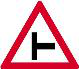 Side road junction from the left. A side road joins from the left ahead, so slow down and watch for traffic entering or crossing.
